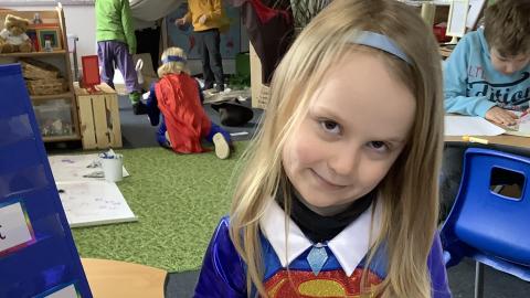 Girl dressed as supergirl