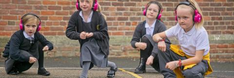 Now Press Play Earphones in use outside on the playground