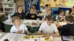 children sitting in classrooom