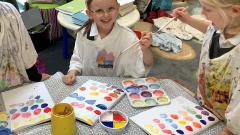 children painting colour swatches