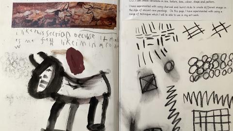 Child’s sketchbook experimenting with different media to recreate stone age art as well as using charcoal to experiment with sketching techniques