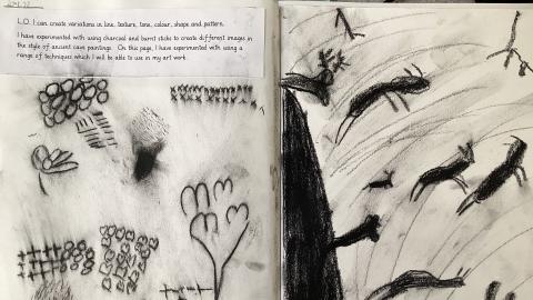 A child’s sketchbook experimenting with charcoal sketching techniques