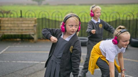 Now Press Play Earphones in use outside on the playground