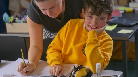 Teacher supporting a Pupil