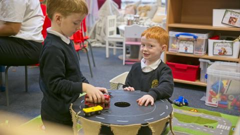 Children play in the small world area