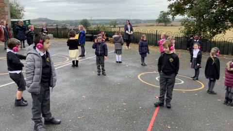 Class 2 outside with headphones on