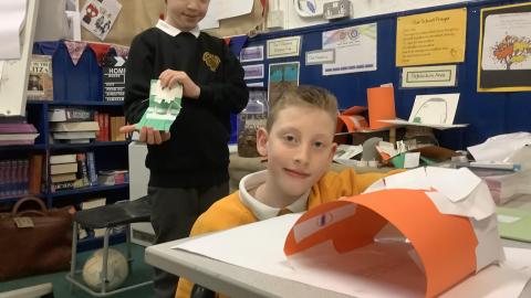 boys showing 3D ww2 shelters