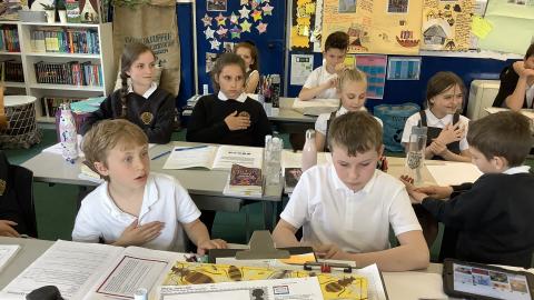 children sitting in classrooom