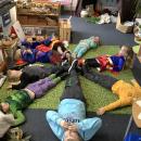 Children laying down on floor