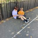 Year 6 buddy reading to his friend
