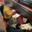 Children in church pew 