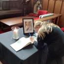 Signing the book of condolence 