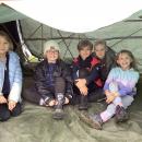 A group of class 3 children sat inside their den