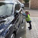 Girl cleaning car