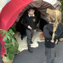Children playing in play cave