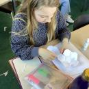 Girl making 3D shapes with paper