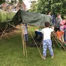 Group of children building den 