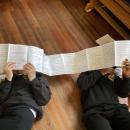 Class 3 pupils reading some of Daniel Ingram browns notes from his first draft of Beas witch 