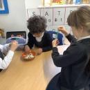 Children threading beads 