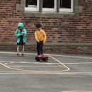 Boy and girl with toy car