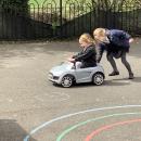 Children in toy car