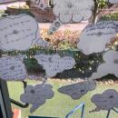 A display of children's writing in small thought bubbles.  