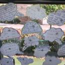 A display of children's writing in small thought bubbles.  The title reads How Nature can help our mental health