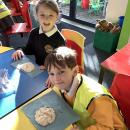 Children with own salt dough fossils