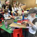Edwardian children building junk model Titanics