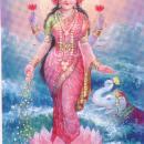 A picture of the Hindu goddess Lakshmi.  She sits in a lotus flower which floats on water and has four arms.  Money pours from one of her hand and she wears lots of golden jewellery. 